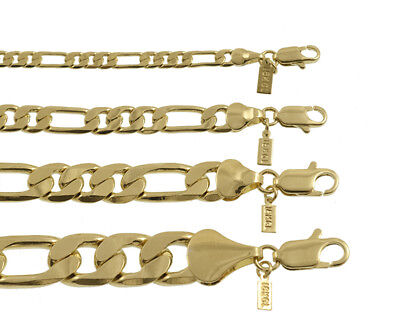 A set of gold - plated chain bracelets.