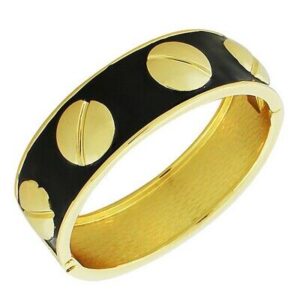 A black and gold bangle with gold dots.