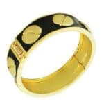 A black and gold bangle bracelet.