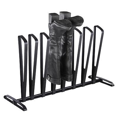 A black shoe rack with several pairs of boots on it.