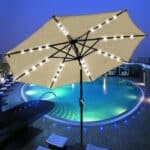 A pool with a tan umbrella.