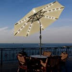 A table and chairs with lights on top of it.