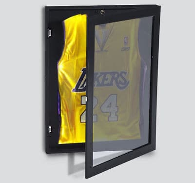 A basketball jersey in a glass case.