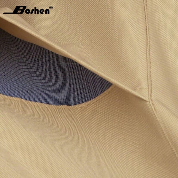 Close-up of a beige fabric with a blue inner lining, featuring the logo "boshen.