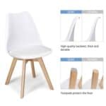 A white dining chair with wooden legs.