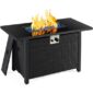 Black outdoor gas fire pit table with a lit flame.