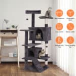 A multi-level gray cat tree with various features and two cats lounging on it.