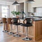 Modern kitchen interior with a breakfast bar and stylish stools.