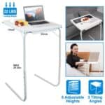 Adjustable and portable laptop desk with tilting tabletop, featuring weight capacity and dimensions, used comfortably on a bed or sofa.