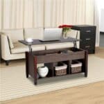 Modern living room with a dark wood coffee table, beige sofa, and a black side cabinet, accented with decorative flowers, a laptop, a cup, and storage baskets.