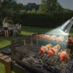 A barbecue grill with skewers on it.