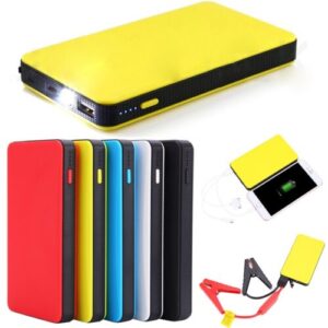 A collection of portable power banks in various colors with a cable and a mobile phone showing the charging process.