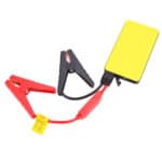 Jump starter cables with a yellow portable battery.