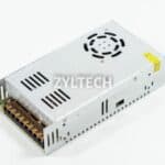 A metal power supply unit with a fan and multiple connection ports, labeled zyltech, on a white background.