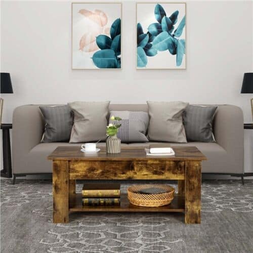 A living room with a coffee table and two paintings.