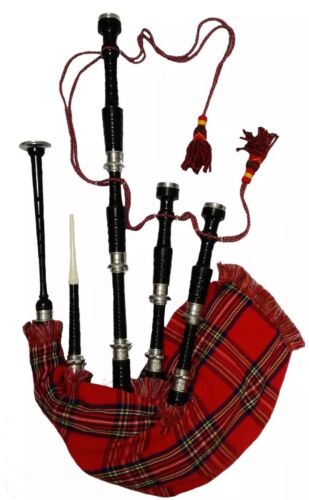 A bagpipe on a red tartan cloth.