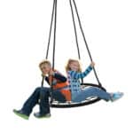 Two children sitting on a swing on a white background.