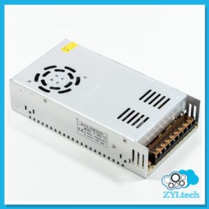 An industrial switch mode power supply unit with multiple output connections, fan, and metallic casing on a white background.