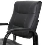 A black leather office chair with arms.