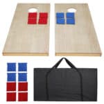 Two wooden cornhole boards with red and blue squares and a bag.