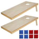 Two wooden cornhole boards with red and blue squares.