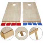 Two wooden cornhole boards with red and blue squares.