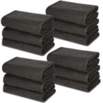 A stack of black towels on a white background.