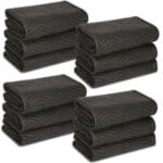 A stack of black towels on a white background.