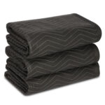 Three black towels stacked on top of each other.