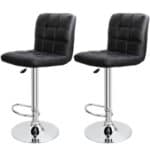 A pair of black leather bar stools on a white background.