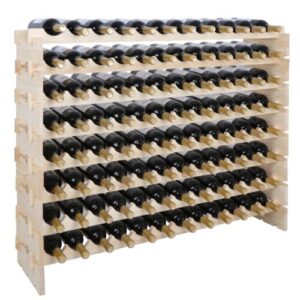 A wooden wine rack with a lot of bottles on it.