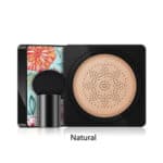 A compact powder foundation with a flower on it.