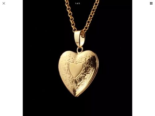 A gold heart locket necklace on a black background.