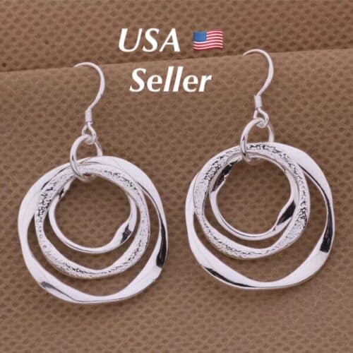 A pair of sterling silver earrings with the words usa seller.