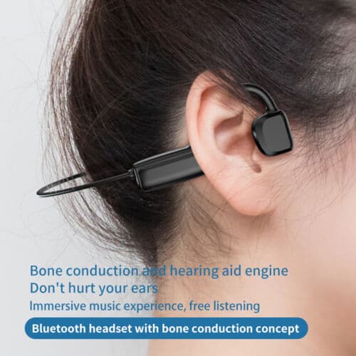 A woman wearing a bluetooth earphone with the text bone conduction hearing aid.