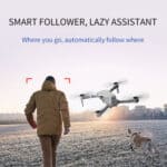 A man with a dog walking in front of a drone with the text smart follow lazy assistant.