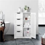 A white bathroom cabinet with four drawers and a bathtub.