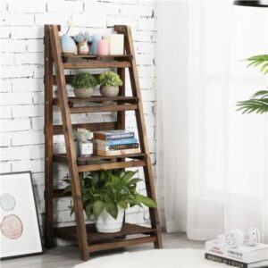A wooden ladder shelf with potted plants and books.