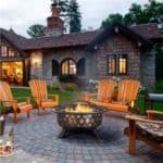 A fire pit in front of a house.