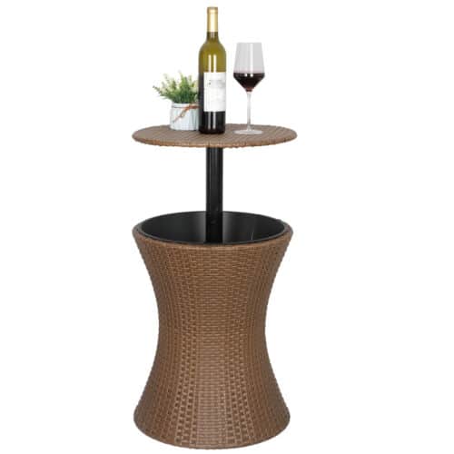 A table with wine bottles and glasses on it.