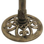 An ornate brass candle holder on a white background.