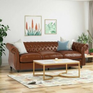 A brown leather sofa in a living room.