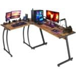 A desk with multiple monitors and a computer.