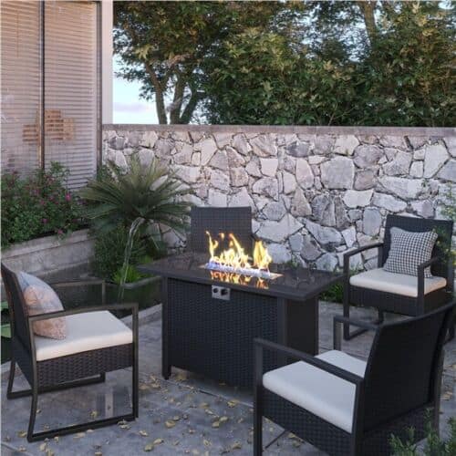 A patio set with a fire pit and chairs.