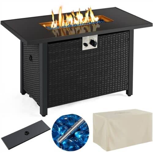 A black outdoor fire pit with a blue cover.