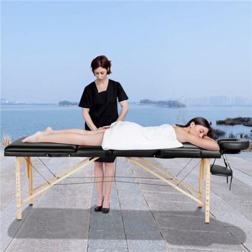 A woman is getting a massage on a massage table.