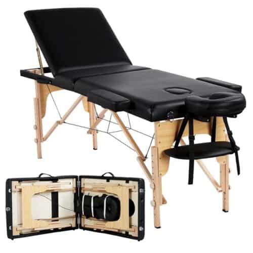 A black massage table with a black cover.
