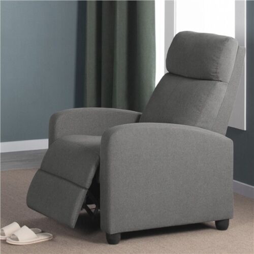 A grey recliner chair in a room.