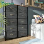 A modern fabric dresser with eight drawers situated in a cozy bedroom.