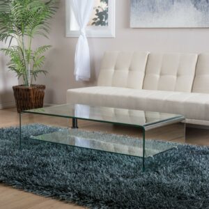 A glass coffee table in a living room.